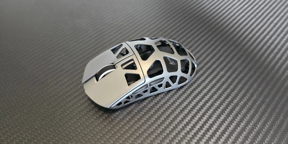 Lightweight gaming mouse with honeycomb shell design for reduced weight