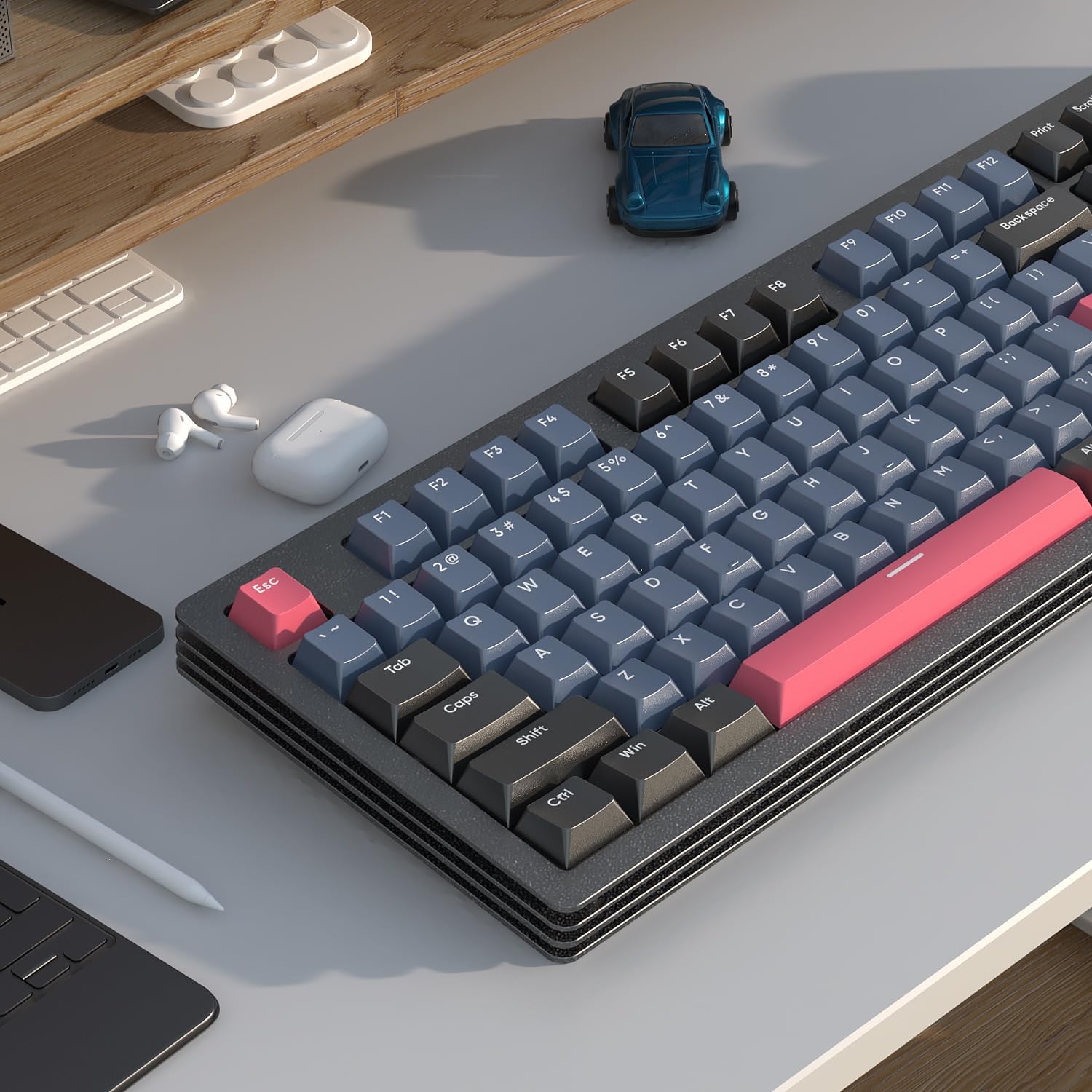 AJAZZ AKC087 keyboard with blue-gray and pink keycaps on a modern desk setup.