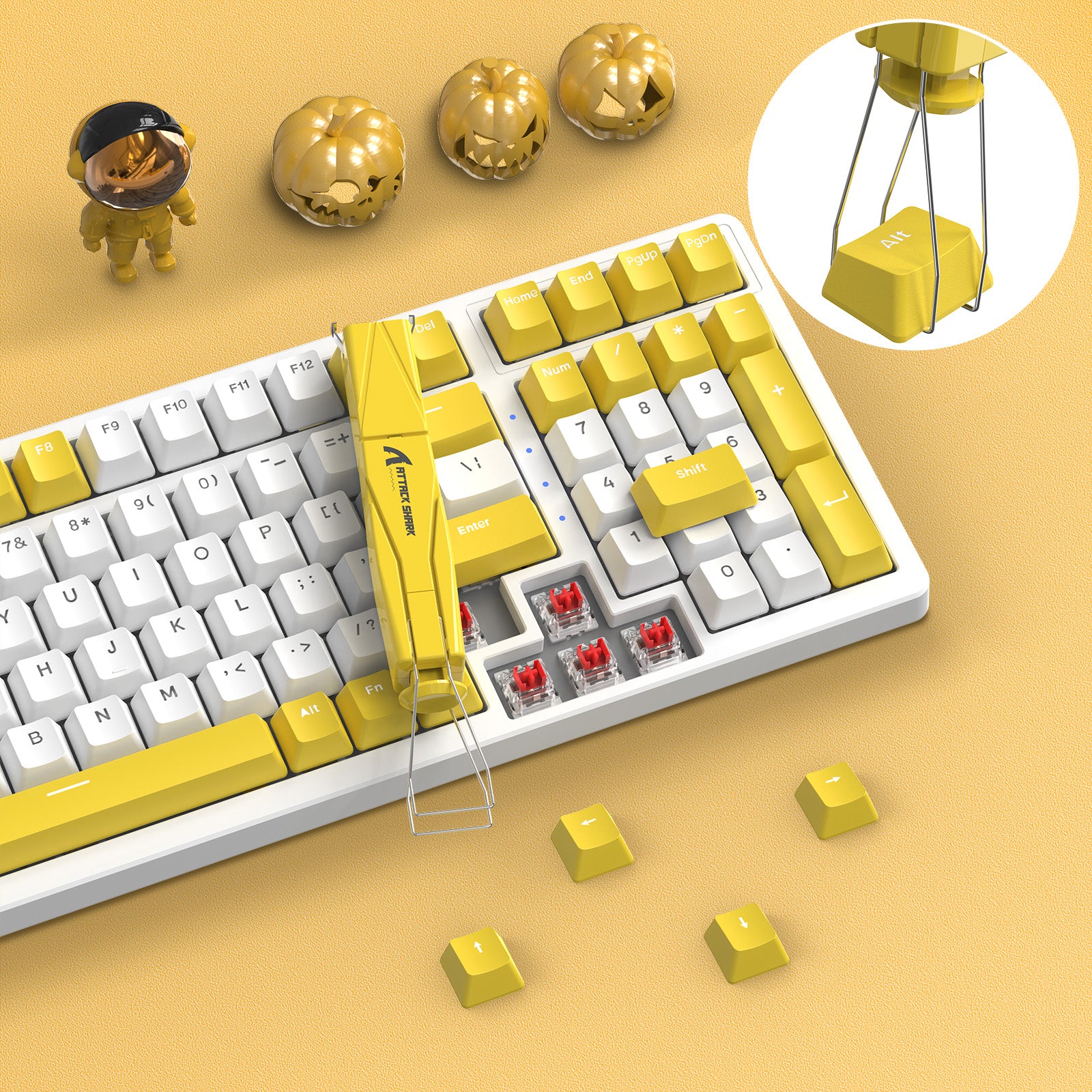 Yellow Attack Shark 2-in-1 keycap and switch puller on keyboard with yellow keycaps.