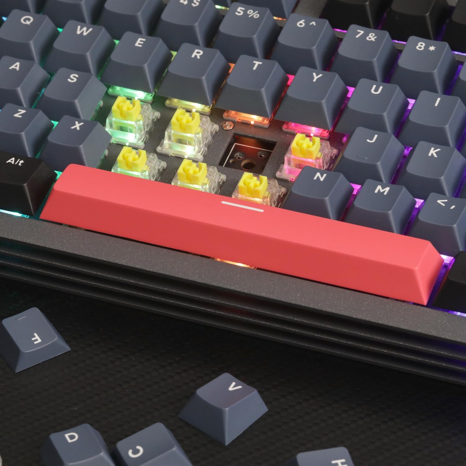 AJAZZ AKC087 keyboard close-up with yellow switches and pink spacebar keycap.