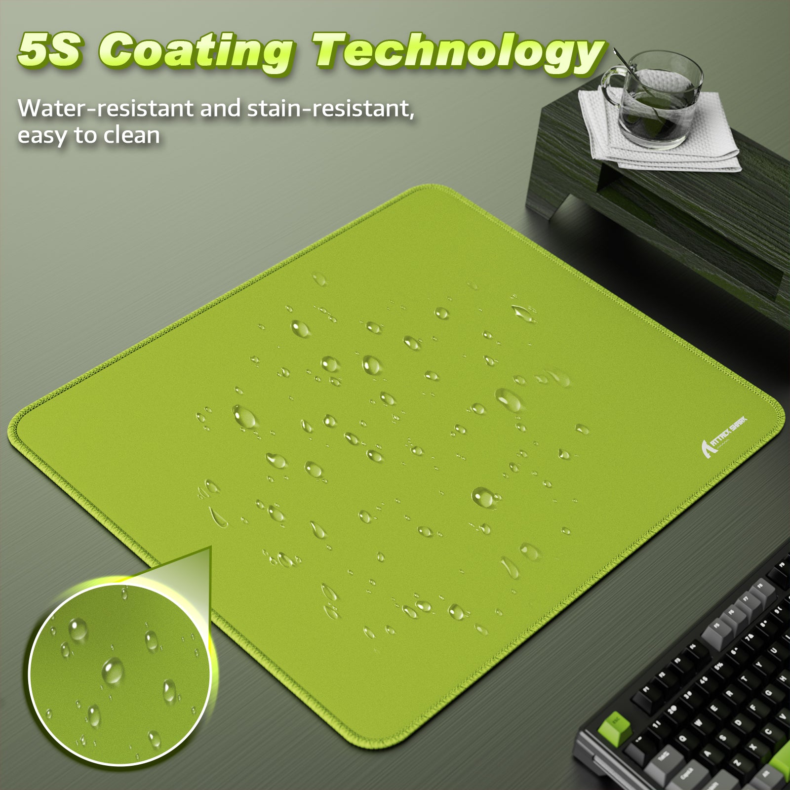 Green Attack Shark mouse pad with 5S water-resistant coating, highlighted water droplets.