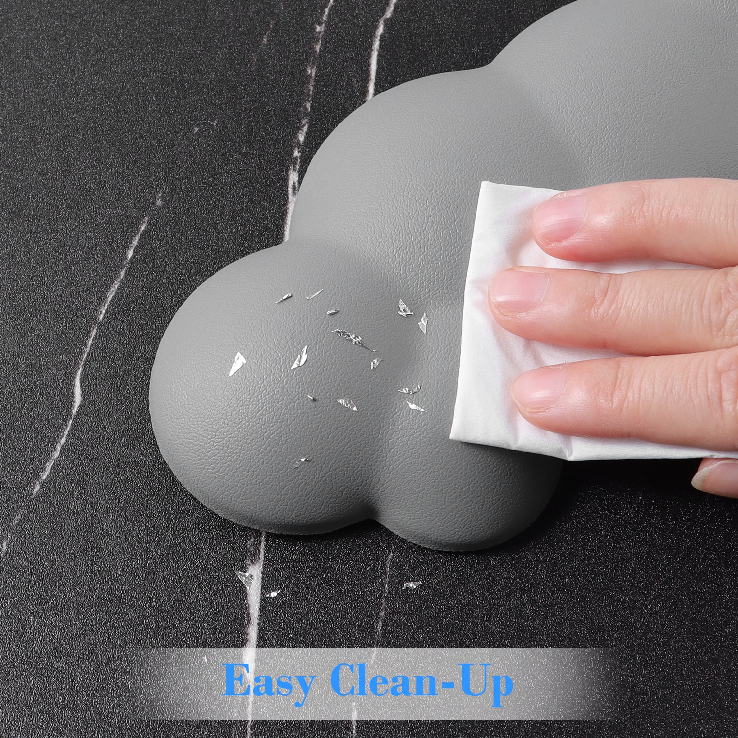 Hand cleaning gray cloud-shaped wrist rest with easy wipe surface.