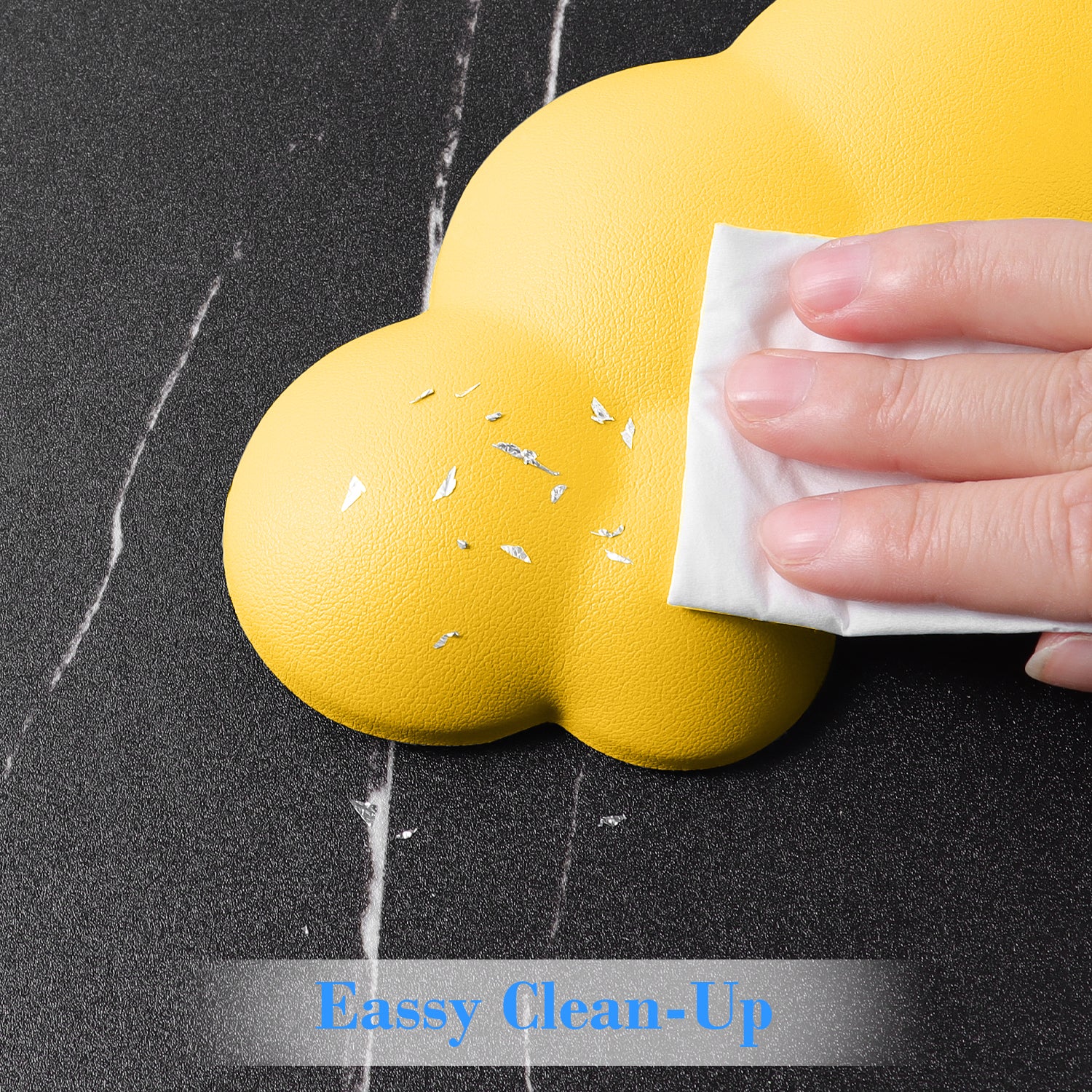 Hand cleaning yellow cloud-shaped wrist rest with easy wipe surface.