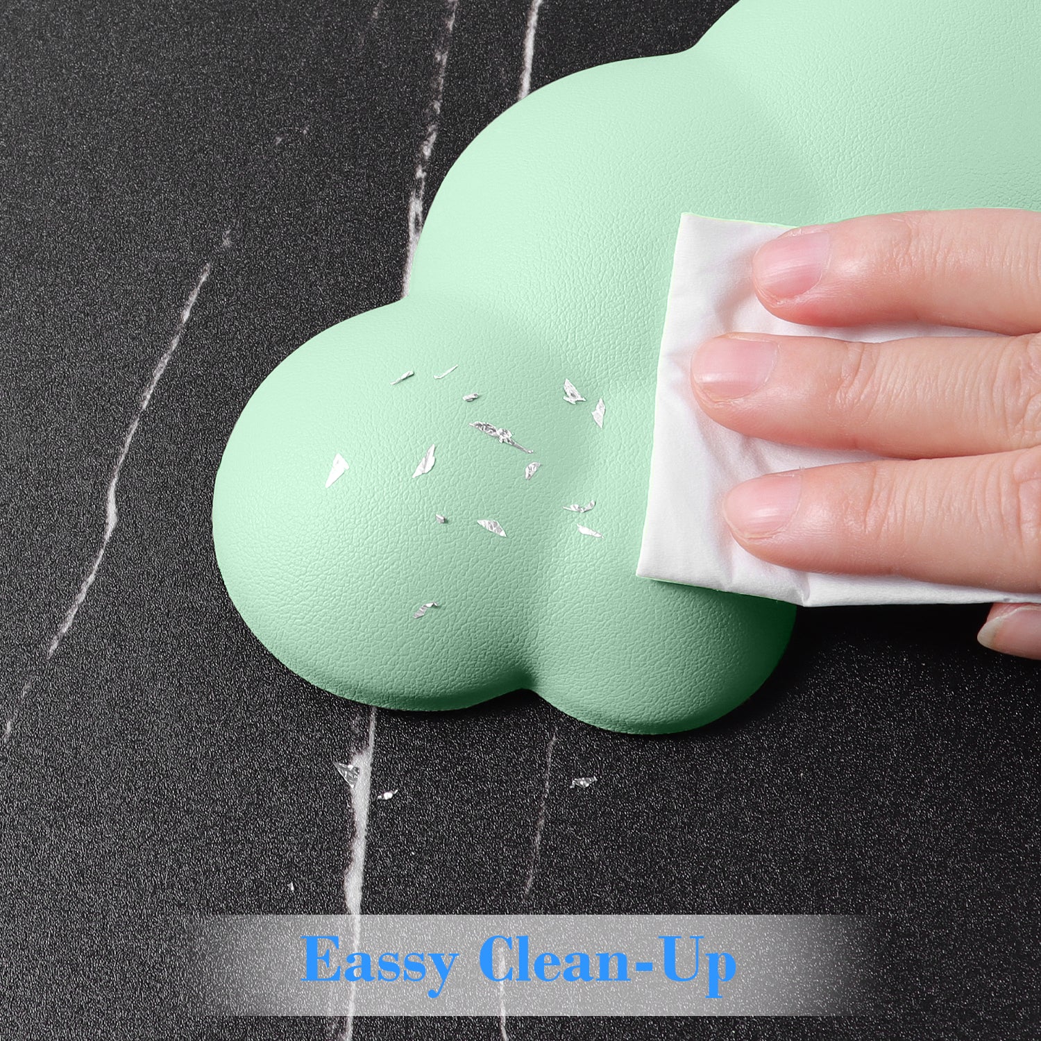 Hand cleaning mint green cloud-shaped ergonomic wrist rest with easy wipe surface.