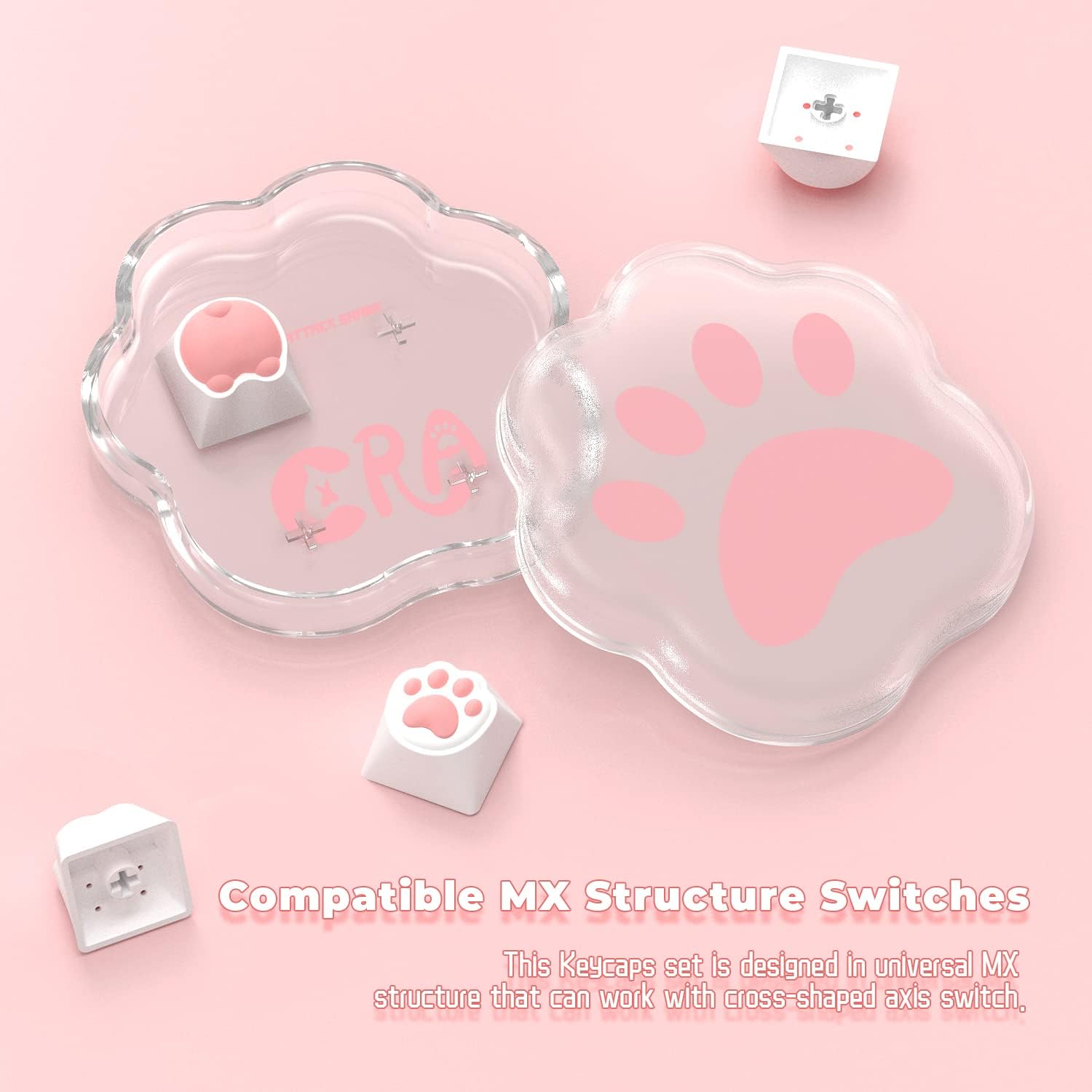 Clear cat paw-shaped storage box with pink paw print and two compatible keycaps.