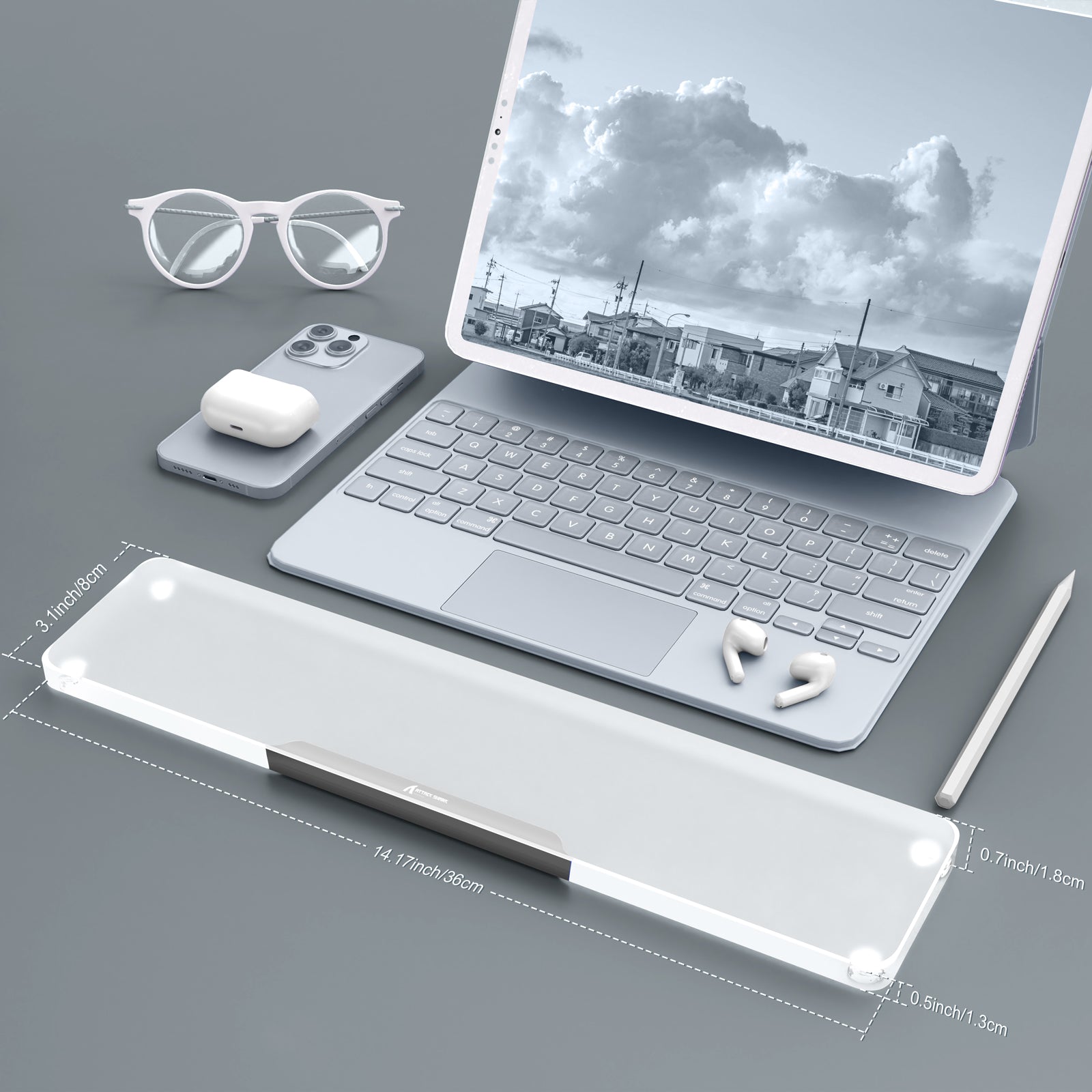 Translucent acrylic wrist rest with anti-slip base and aluminum edge near tablet and keyboard.