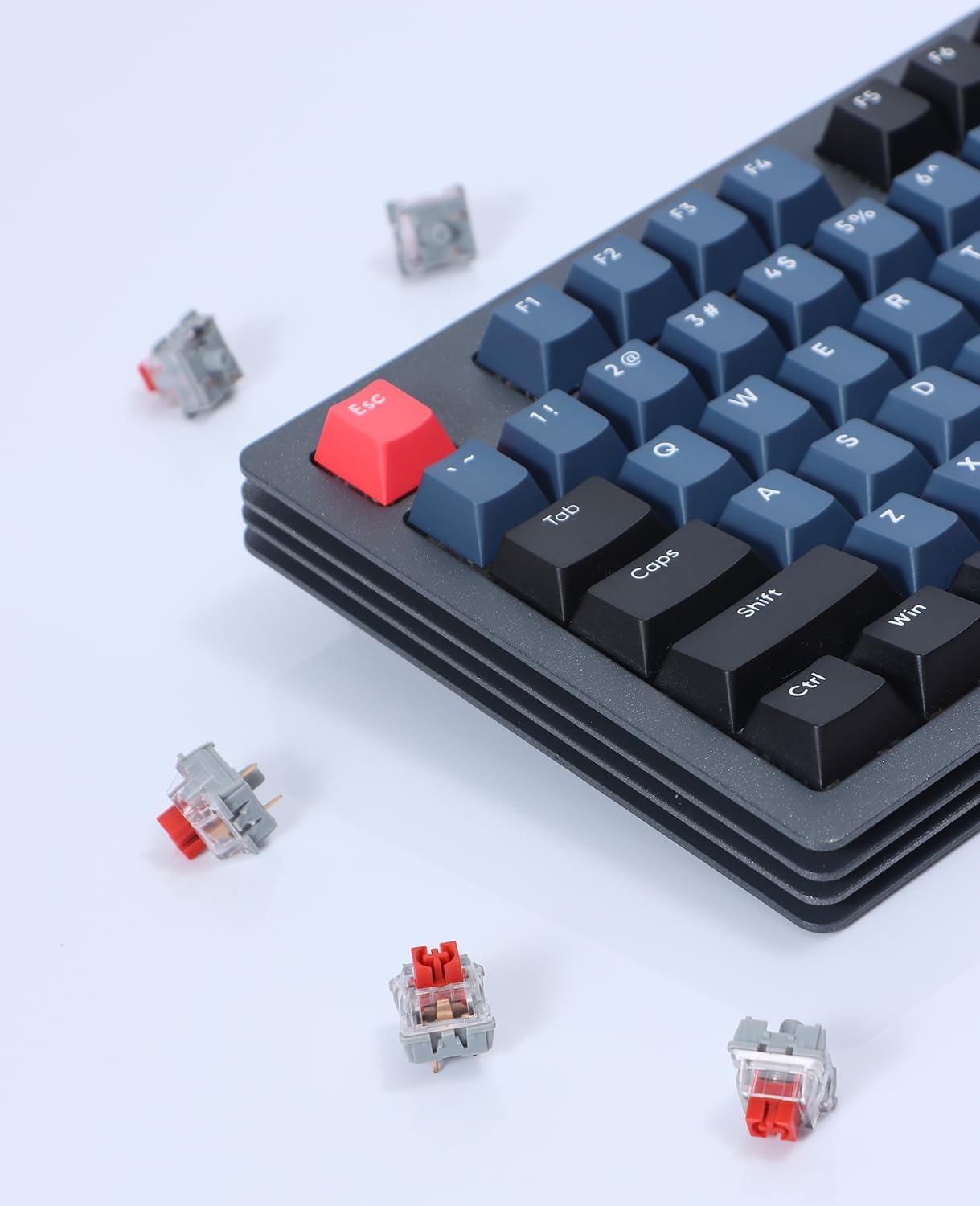 Mechanical keyboard with blue keycaps, red ESC key, and AS switches scattered around.