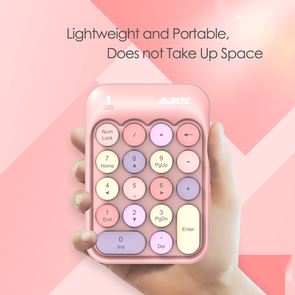 Pink AJAZZ AK18 wireless numeric keypad held in hand, emphasizing portability and compact design.