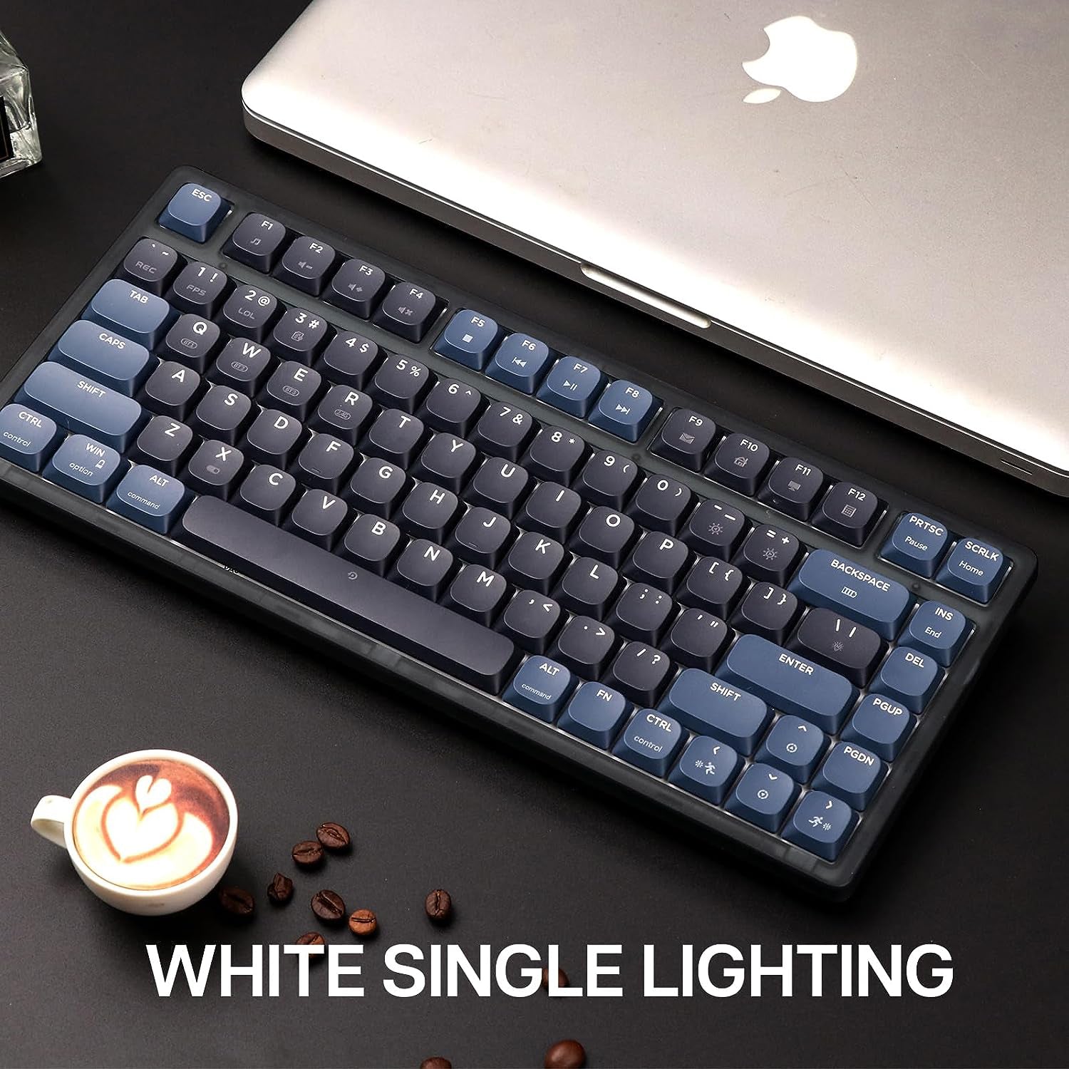 AK832PRO keyboard with white single lighting on a black desk next to a coffee cup.