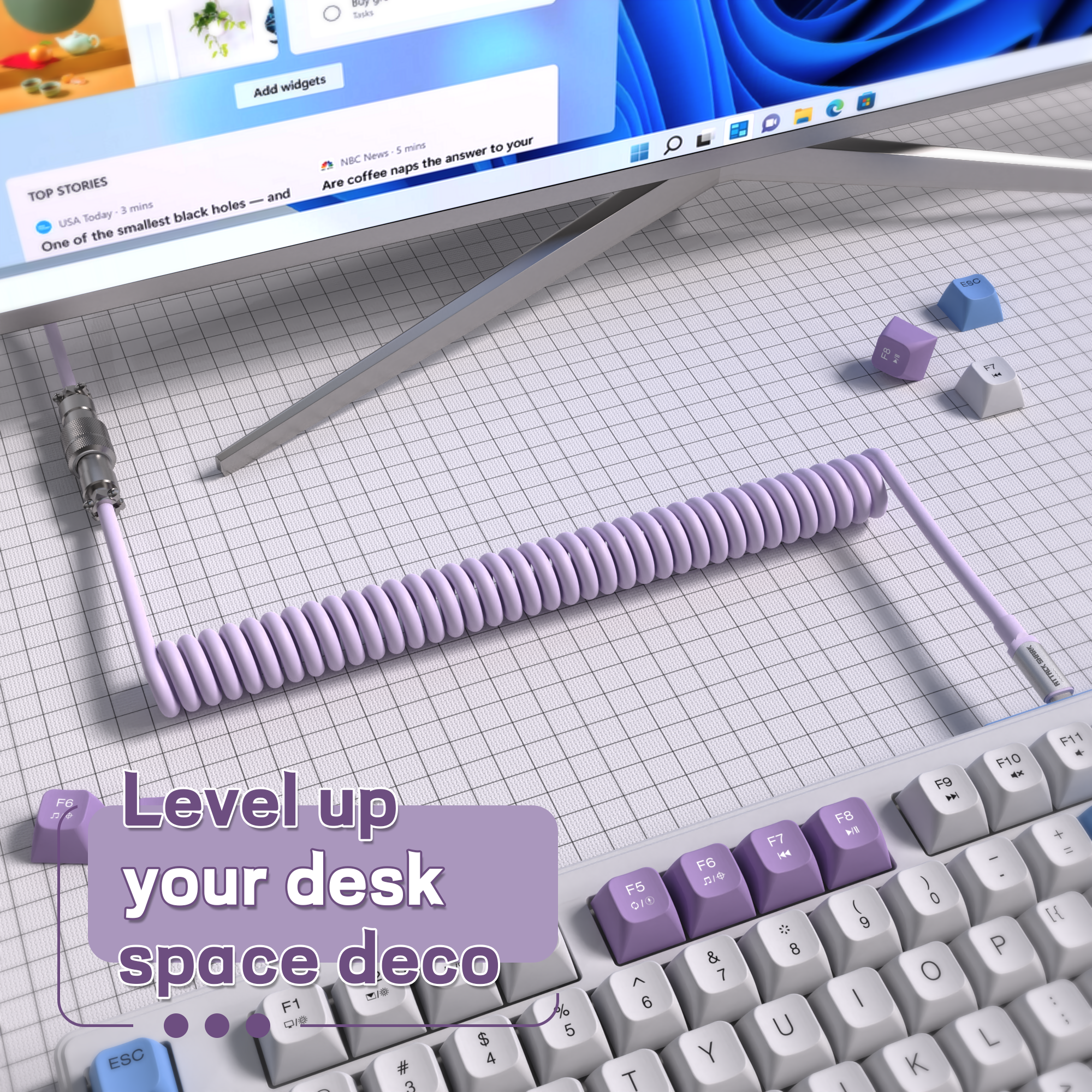 Lavender coiled USB C keyboard cable enhancing desk decor with modern design.