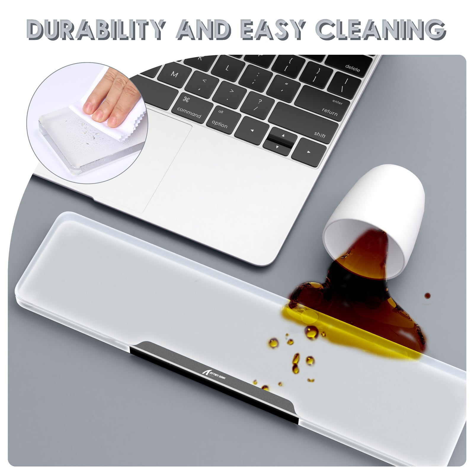 Clear acrylic wrist rest demonstrating durability and easy cleaning next to a laptop.