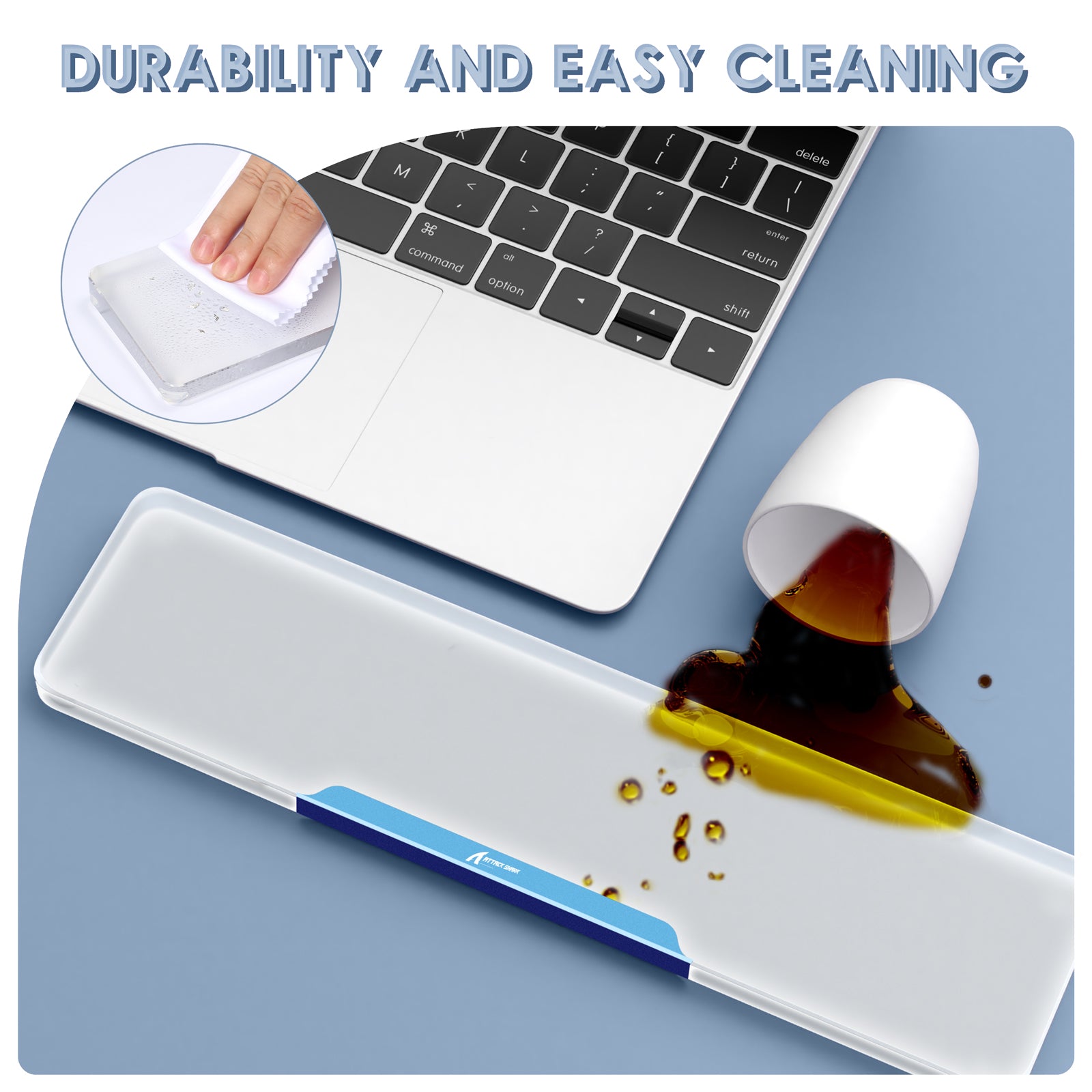 Clear acrylic wrist rest showcasing durability and easy cleaning beside a laptop.