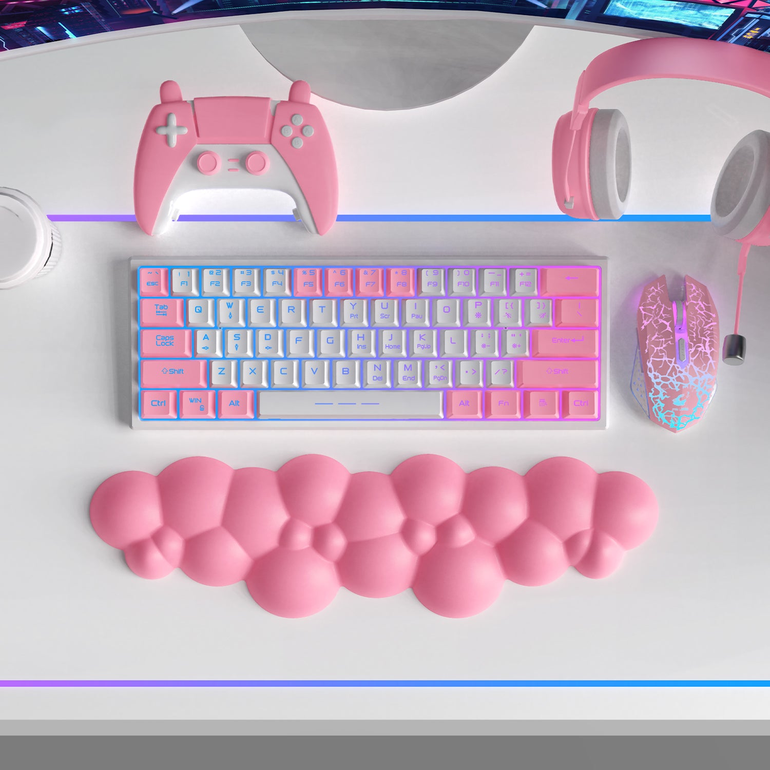 Pink cloud-shaped ergonomic wrist rest beneath a pastel mechanical keyboard and gaming gear.