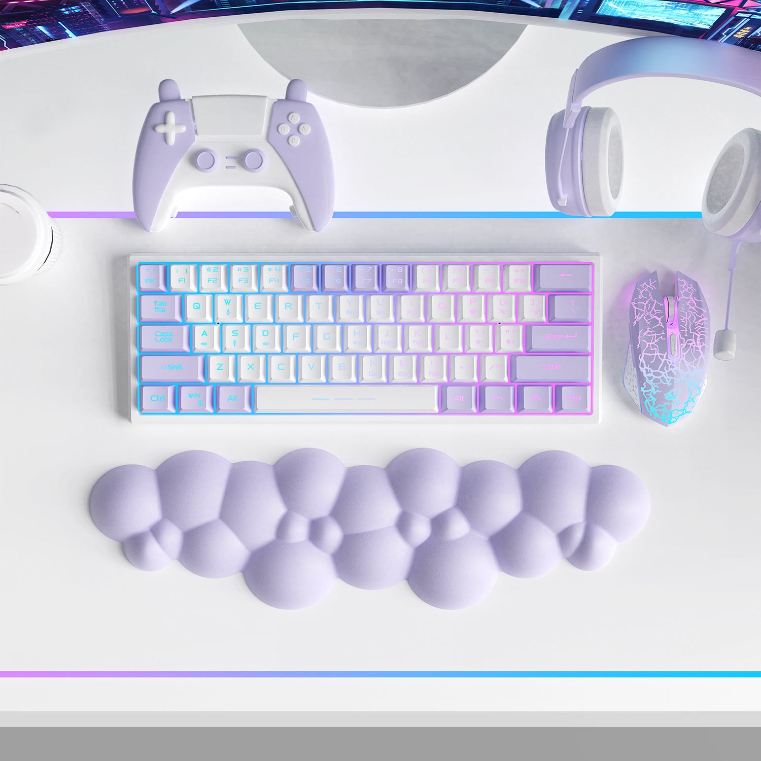 Purple cloud-shaped wrist rest beside pastel RGB keyboard and gaming accessories.