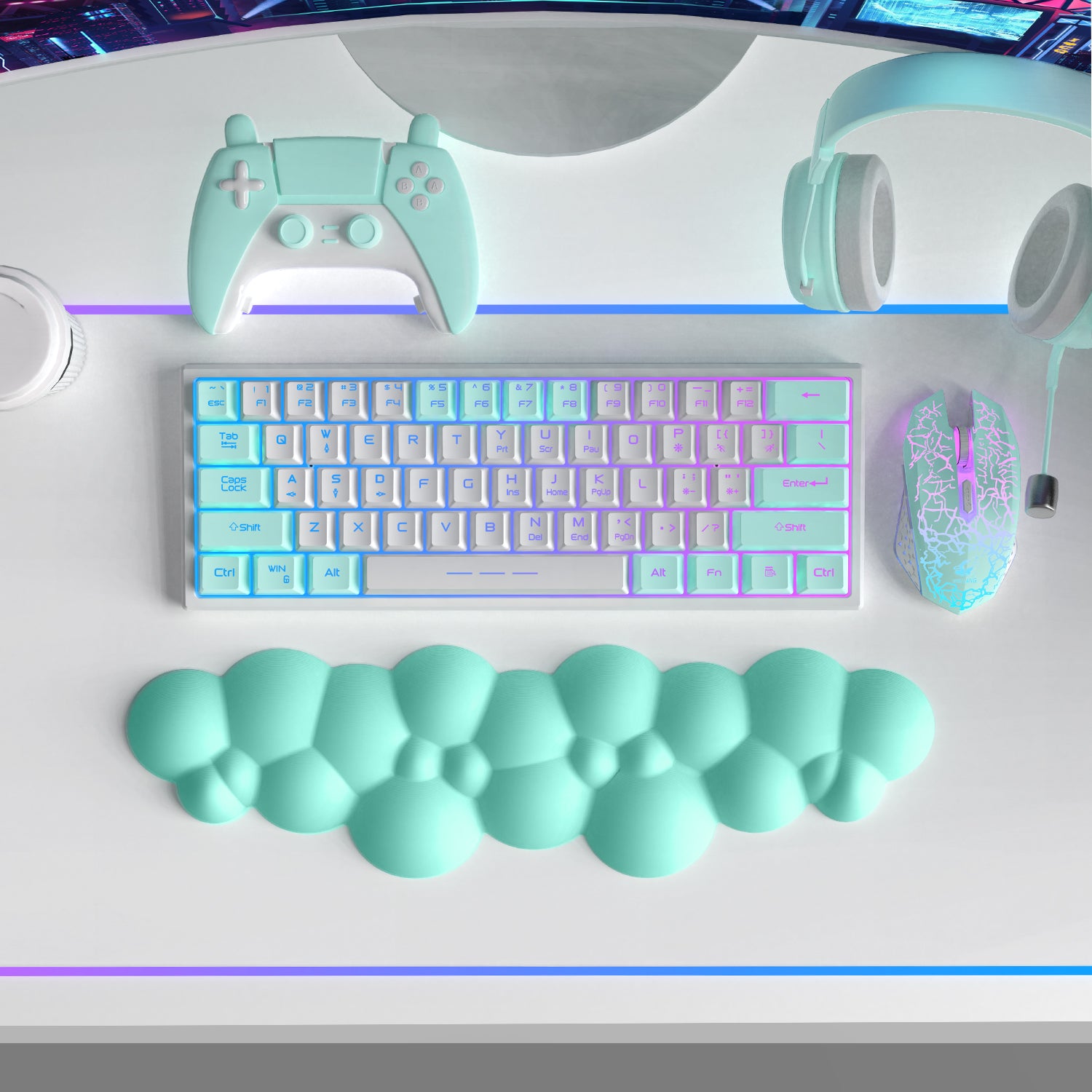 Mint green cloud-shaped wrist rest with ergonomic design beside pastel keyboard and accessories.