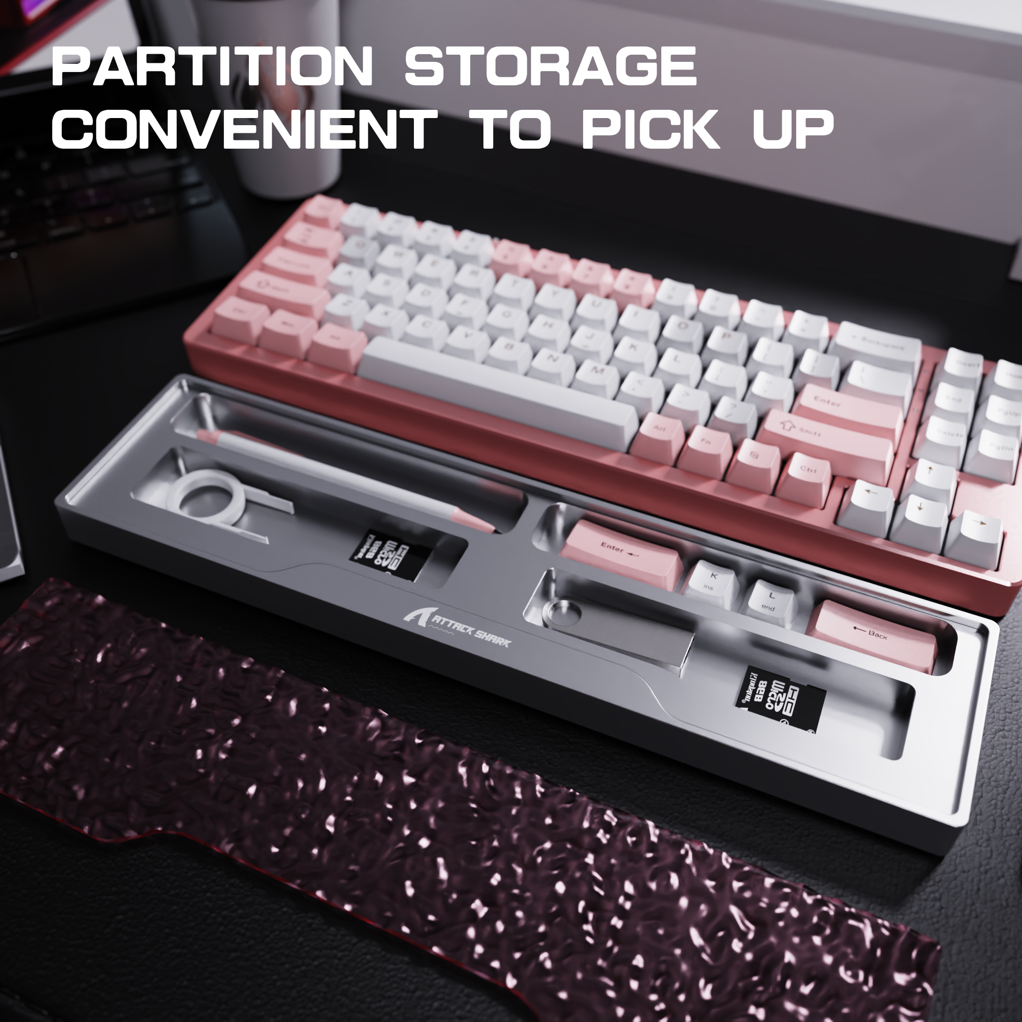 Pink and white Attack Shark keyboard with accessories and partition storage for organization.