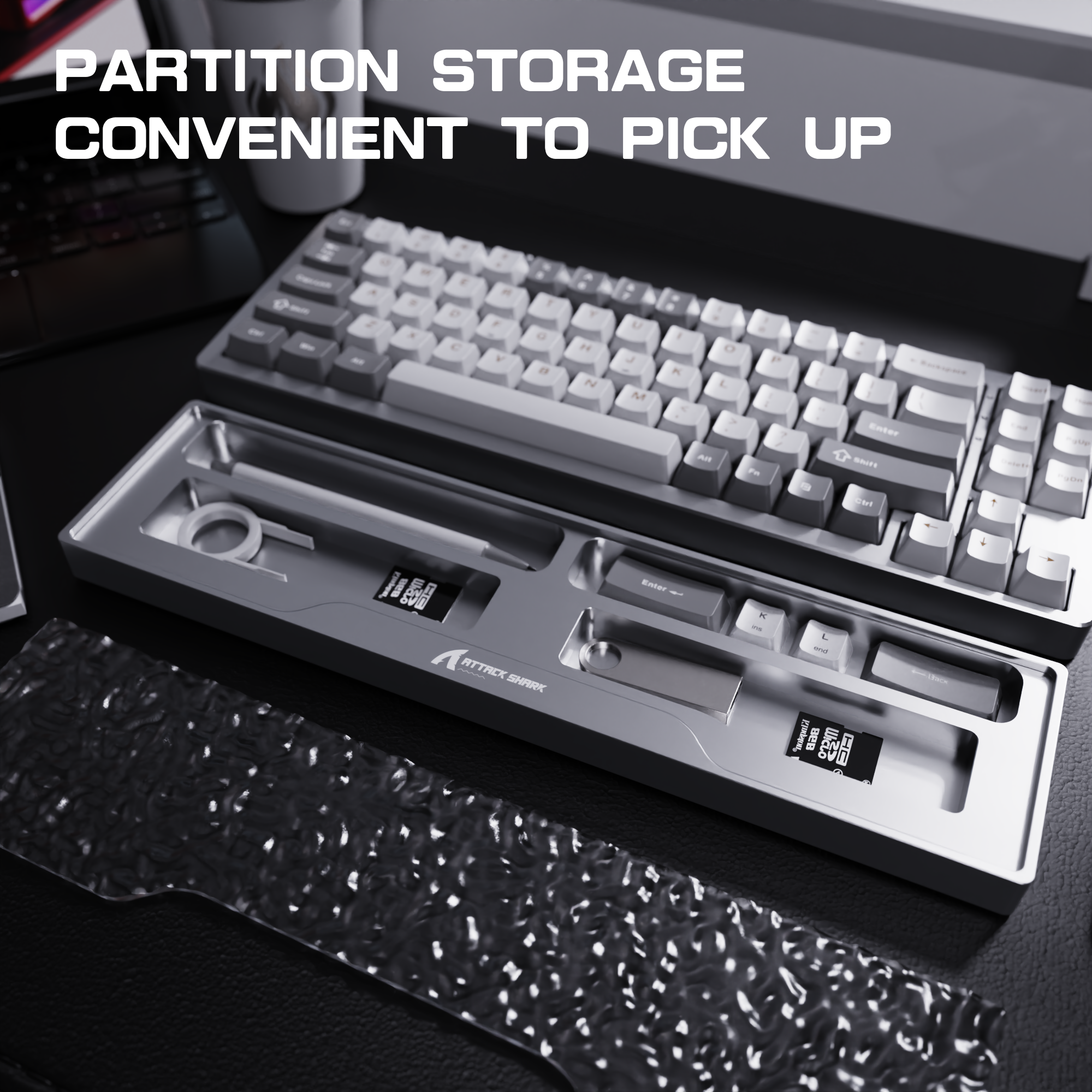 Gaming keyboard with aluminum partition storage tray for organized accessories.