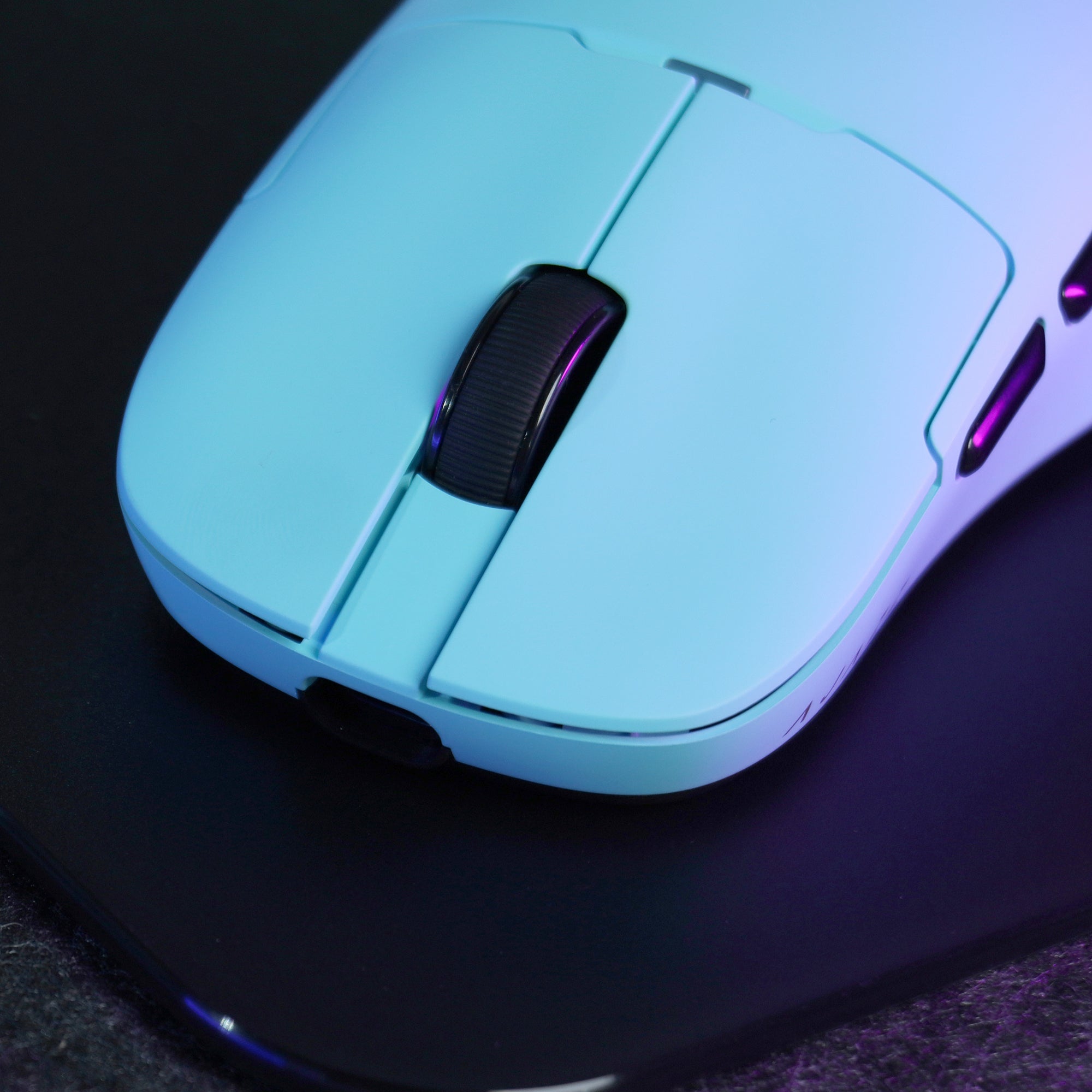 Close-up of AJAZZ AJ159 APEX gaming mouse in gradient blue on gaming mousepad.